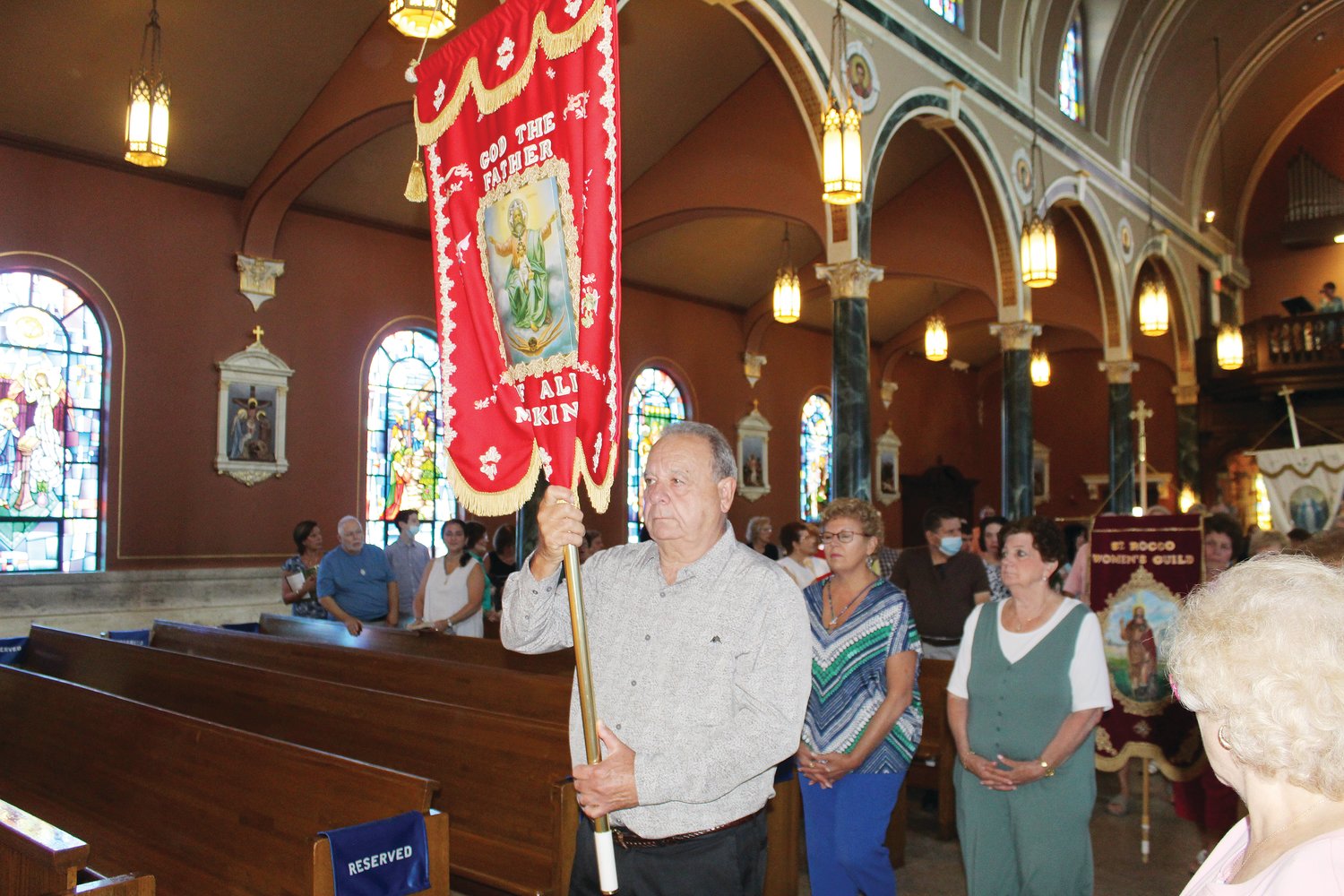 Faithful process at St. Mary’s Church in Cranston on August 7 in celebration of God the Father.